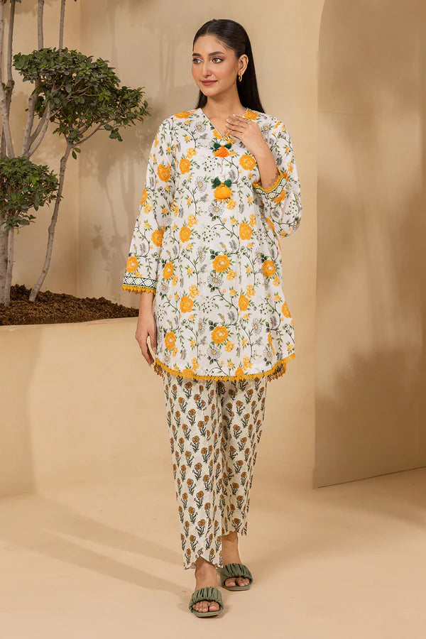 Woman wearing a floral outfit standing against a beige background