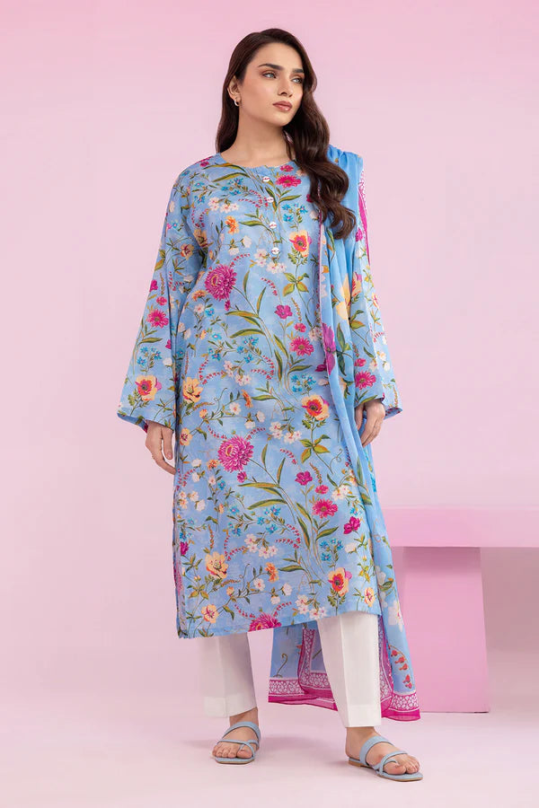 Woman wearing a light blue floral dress with a pink background